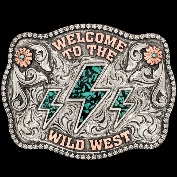Embrace your inner cowgirl with the Wild West Buckle. This buckle features our signature Crushed Turquoise Stones and beautiful Copper lettering on a hand engraved base.